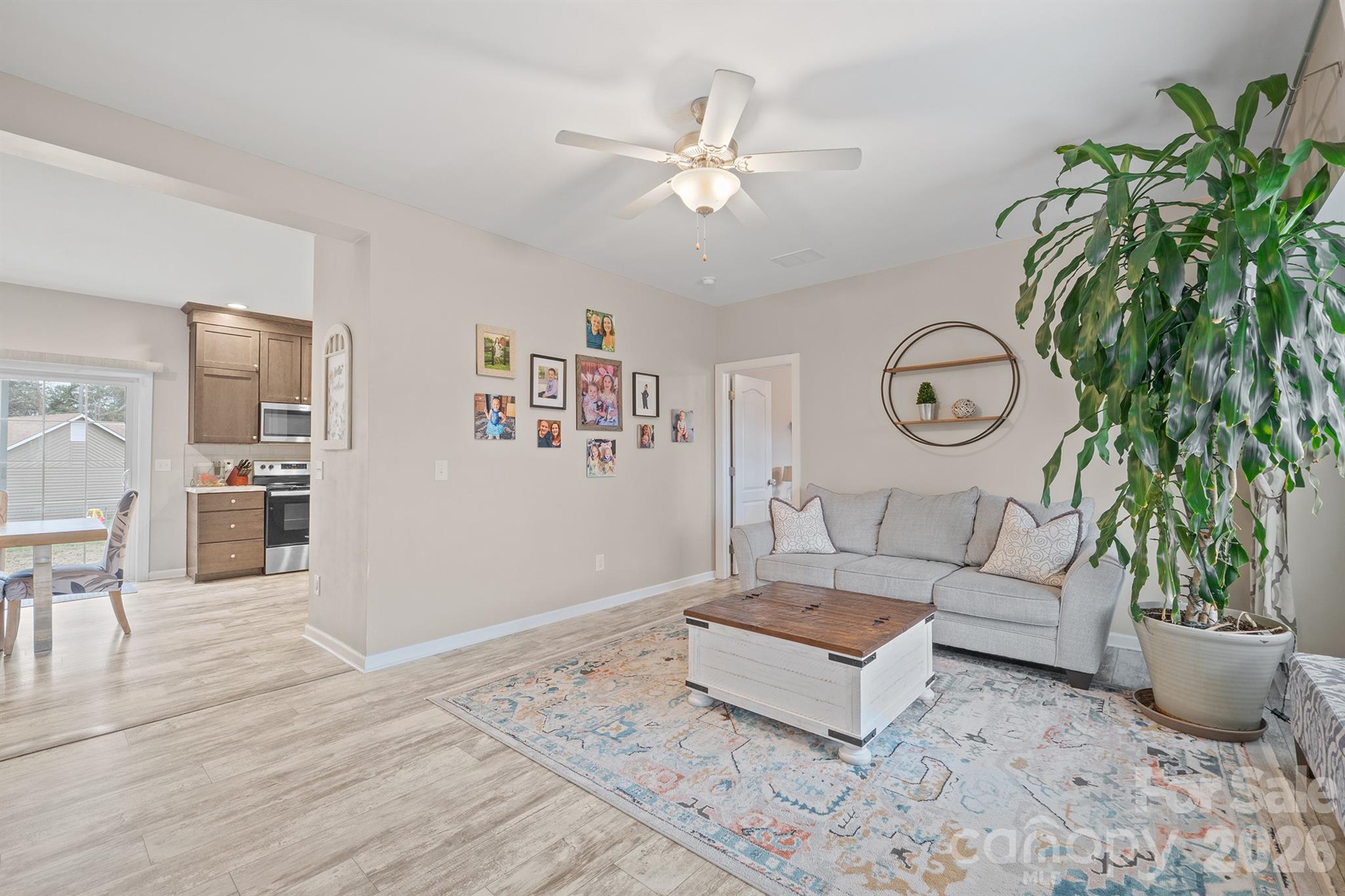 486 Stutts Road Mooresville, NC 28117 - Photo 3 of 35 a living room with furniture and wooden floor