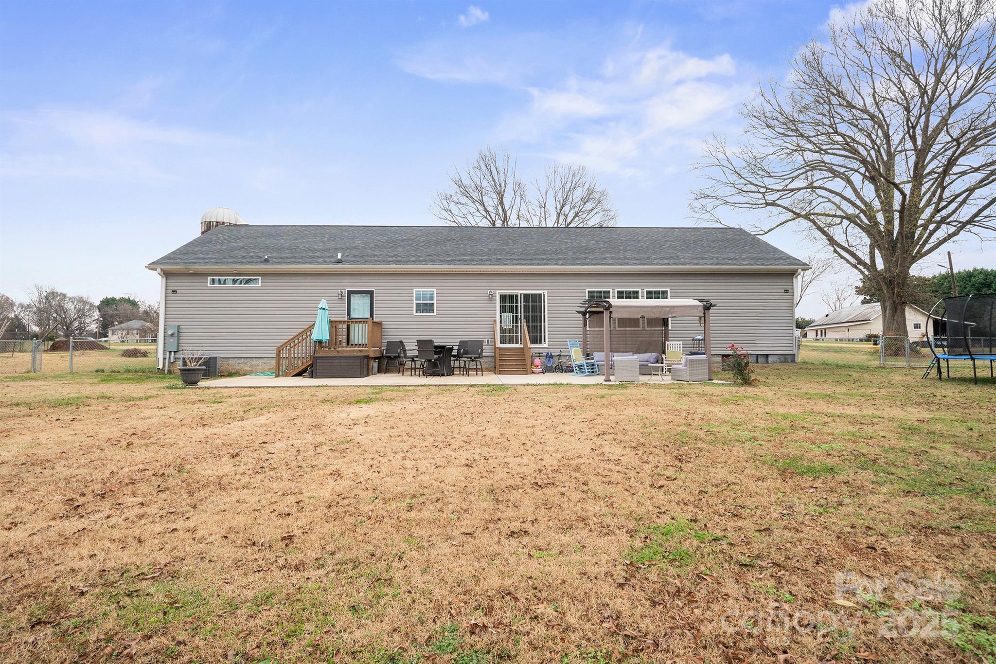 486 Stutts Road Mooresville, NC 28117 - Photo 35 of 35 a front view of house with yard and trees in the background