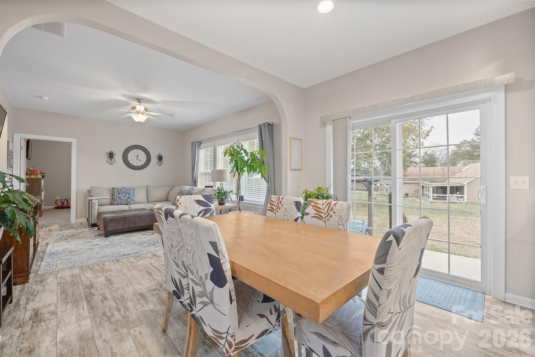 486 Stutts Road Mooresville, NC 28117 - Photo 8 of 35 a view of a dining room with furniture window and wooden floor