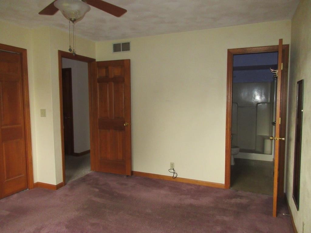 3917 Montclair Road Roscoe, IL 61073 - Photo 11 of 18 an empty room with closet and a chandelier fan