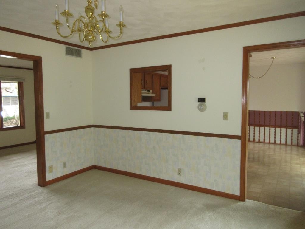3917 Montclair Road Roscoe, IL 61073 - Photo 4 of 18 a view of an empty room with a window