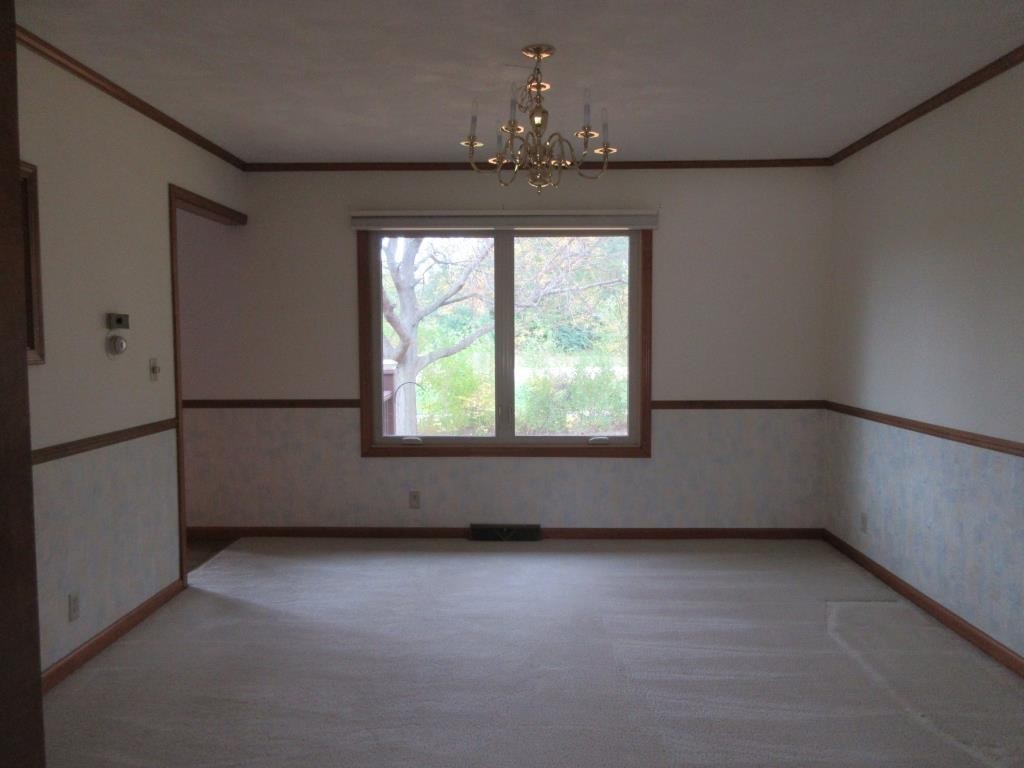 3917 Montclair Road Roscoe, IL 61073 - Photo 5 of 18 a view of an empty room with a window