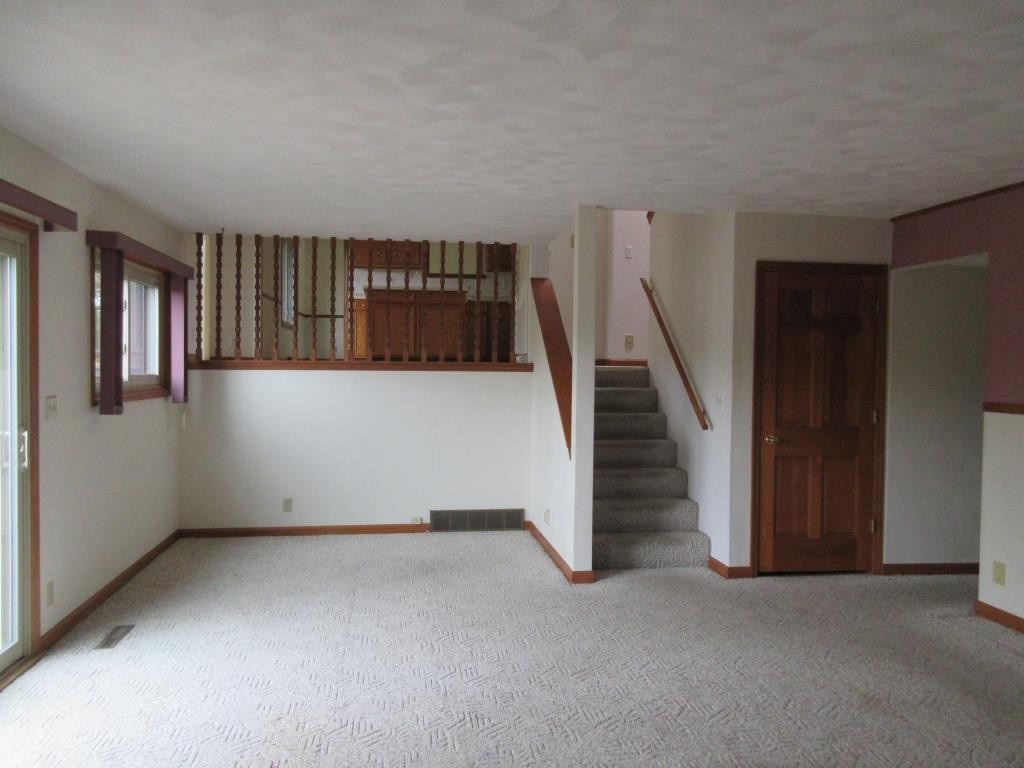 3917 Montclair Road Roscoe, IL 61073 - Photo 8 of 18 a view of a hallway with staircase