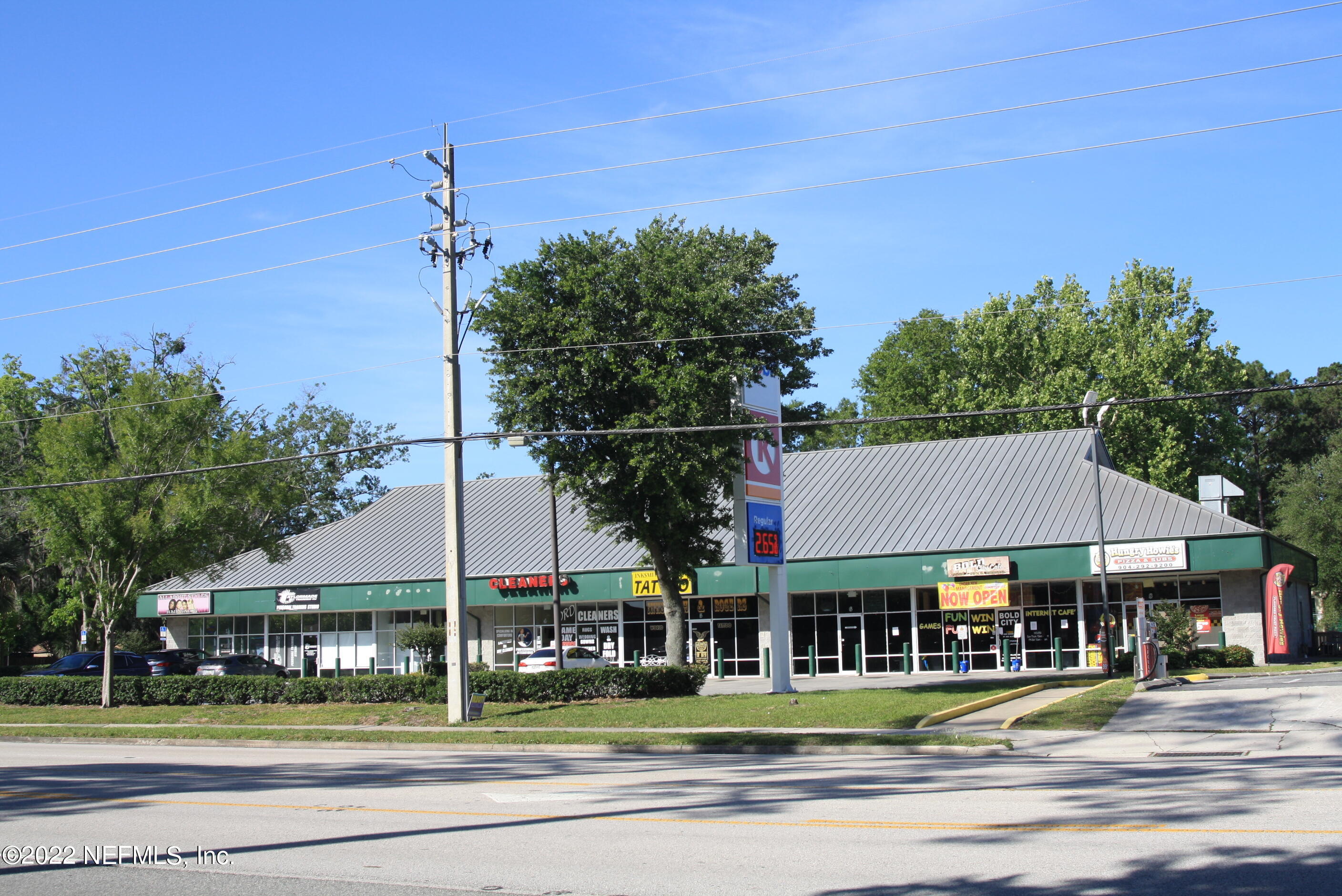 a view of a food mall next to a yard