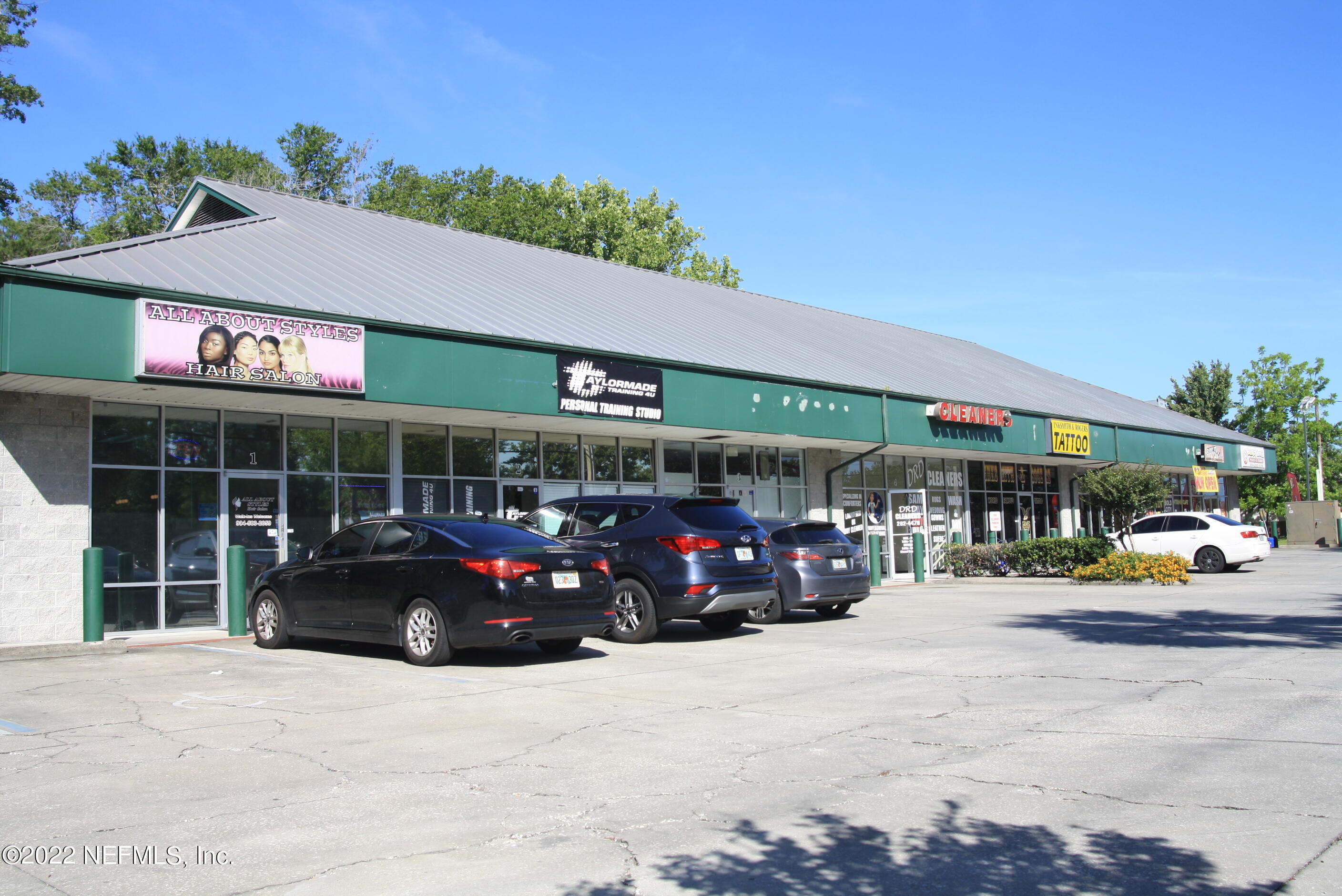 9766 Old St Augustine Road, Unit 7 Jacksonville, FL 32257 - Photo 2 of 9 a view of a cars park in front of a building