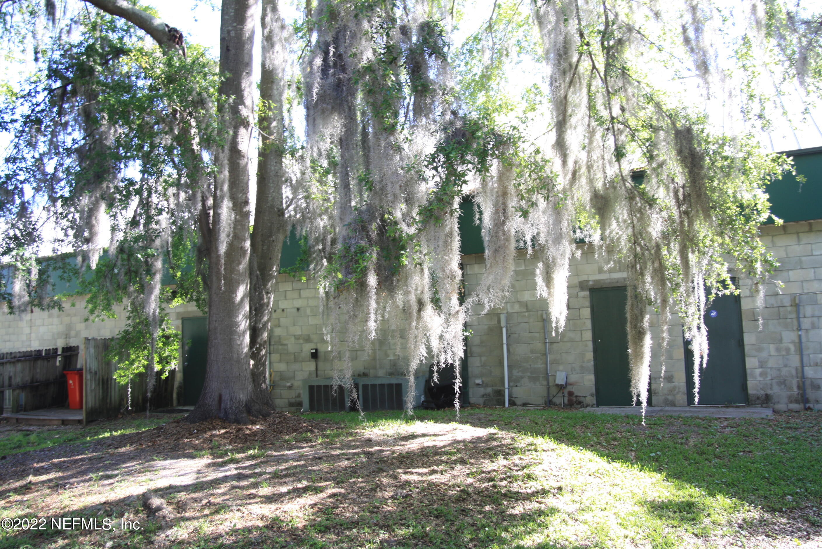 9766 Old St Augustine Road, Unit 7 Jacksonville, FL 32257 - Photo 3 of 9 a backyard of a house with lots of green space and fountain