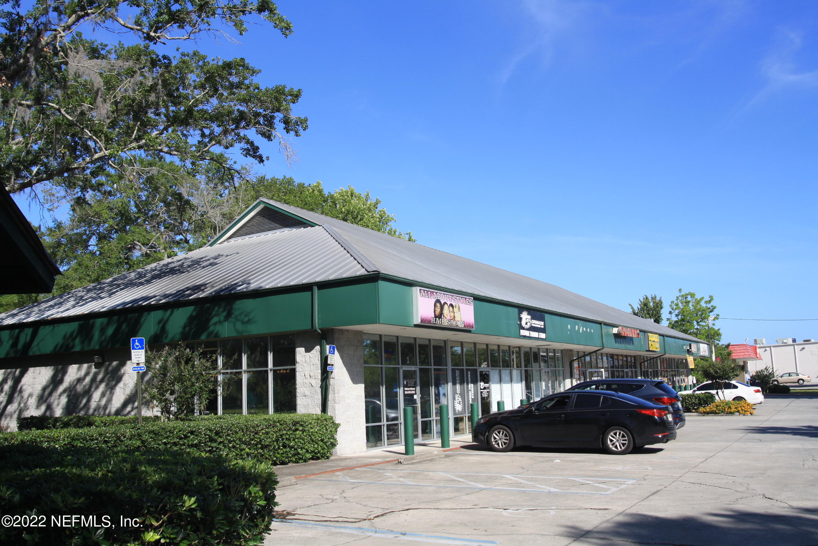 9766 Old St Augustine Road, Unit 7 Jacksonville, FL 32257 - Photo 4 of 9 a car parked in front of a building