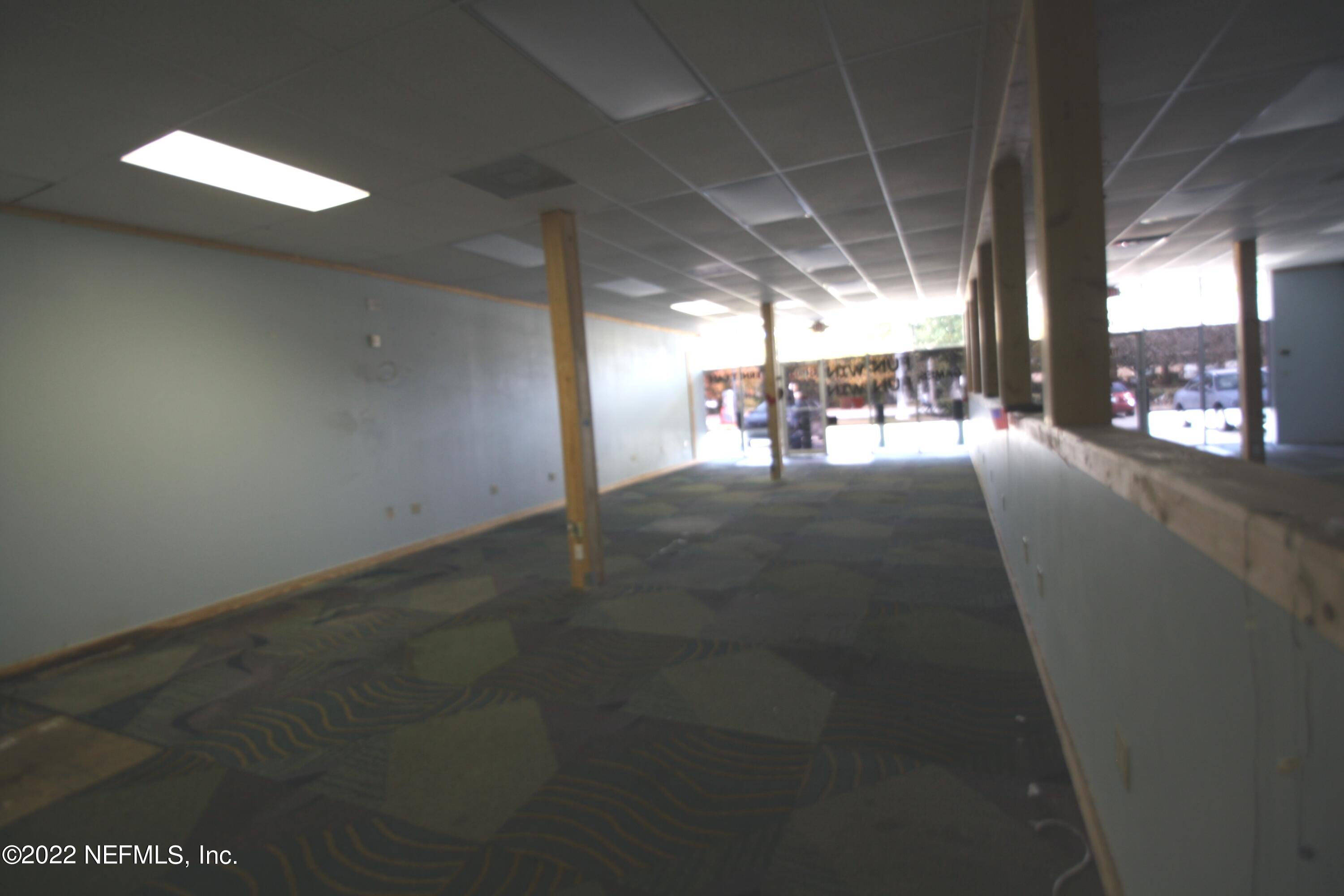 9766 Old St Augustine Road, Unit 7 Jacksonville, FL 32257 - Photo 9 of 9 a view of a hall with yard