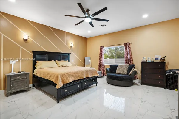 a bedroom with a bed and dresser