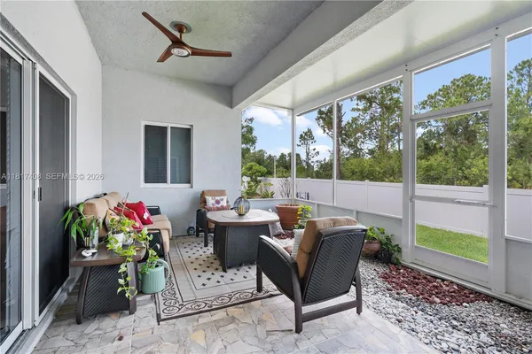 a outdoor living space with furniture and garden view