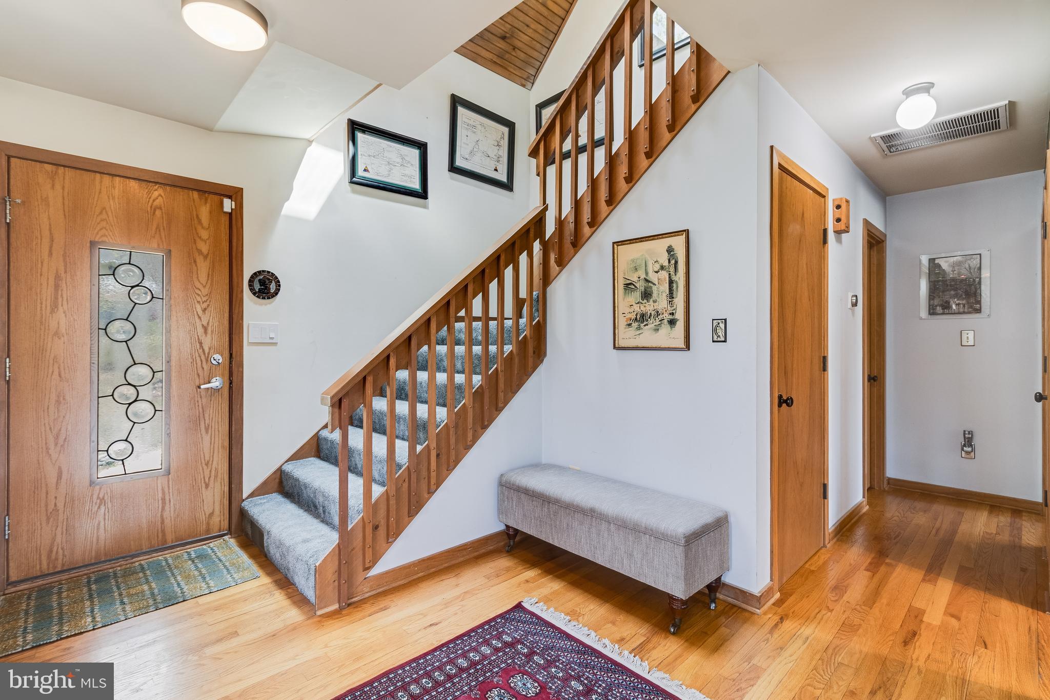247 Frontier Trail Lusby, MD 20657 - Photo 22 of 62 a view of entryway and hall with wooden floor