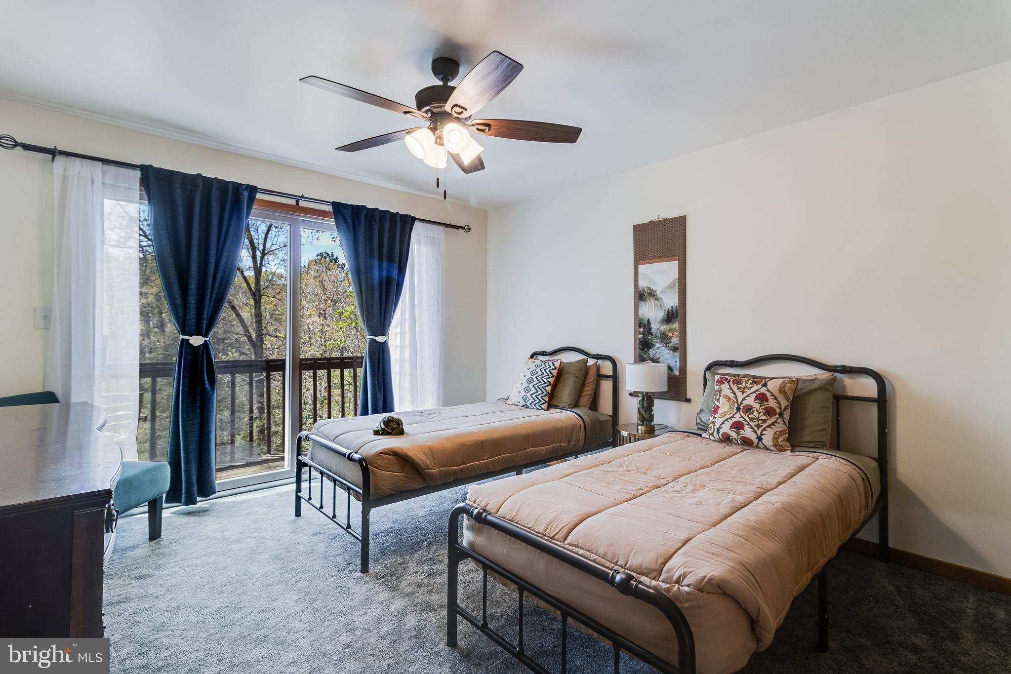 247 Frontier Trail Lusby, MD 20657 - Photo 30 of 62 a bedroom with two beds and a window