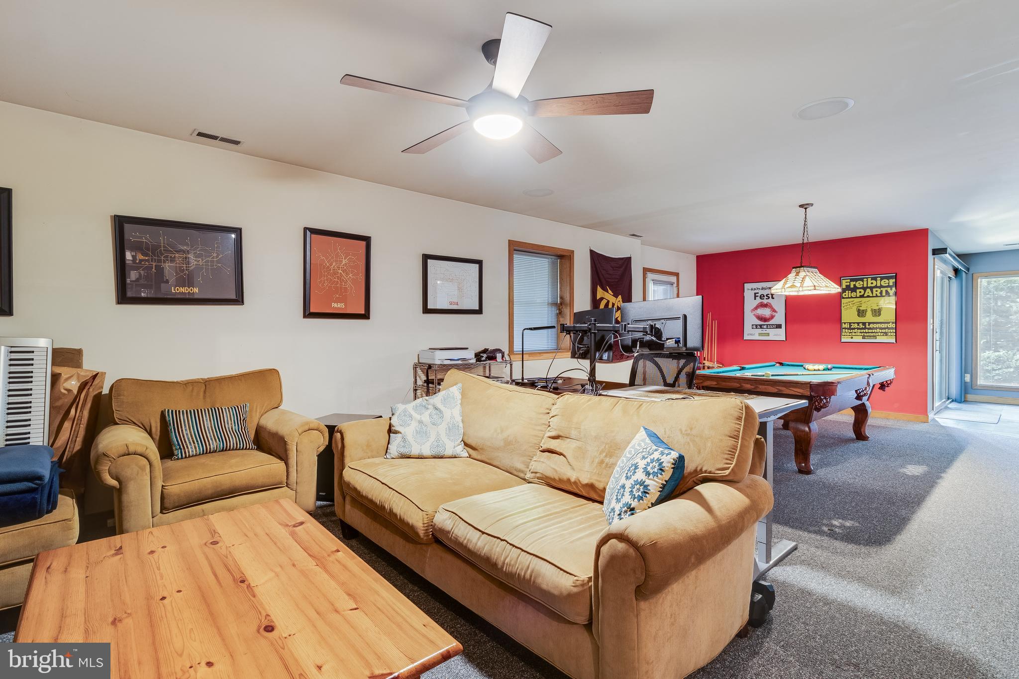 247 Frontier Trail Lusby, MD 20657 - Photo 42 of 62 a living room with furniture ceiling fan and a rug