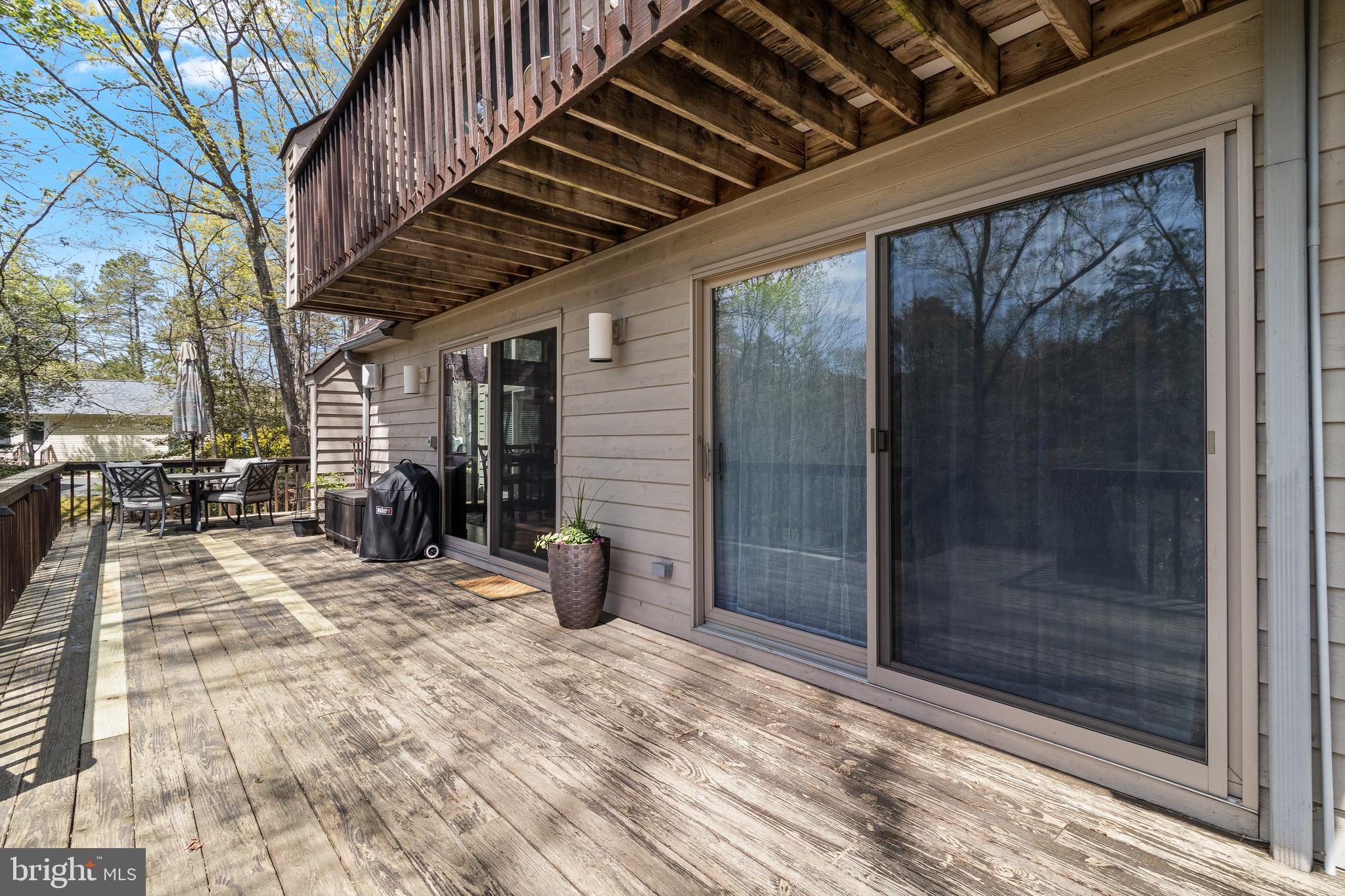 247 Frontier Trail Lusby, MD 20657 - Photo 48 of 62 a view of a porch with a table and chairs