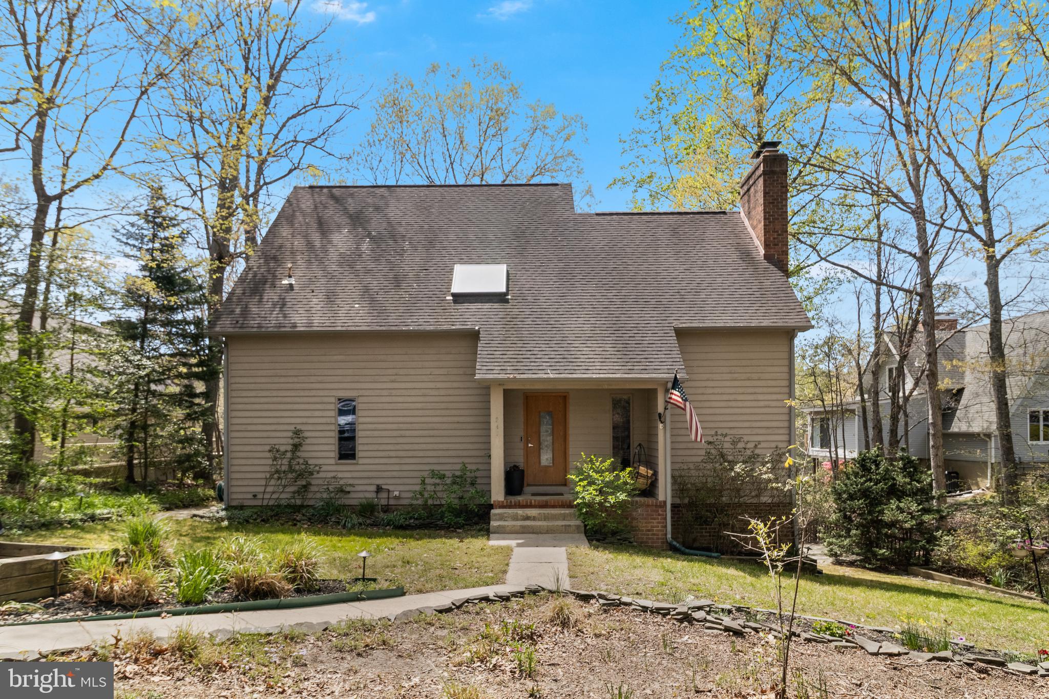247 Frontier Trail Lusby, MD 20657 - Photo 5 of 62 a front view of a house with a yard
