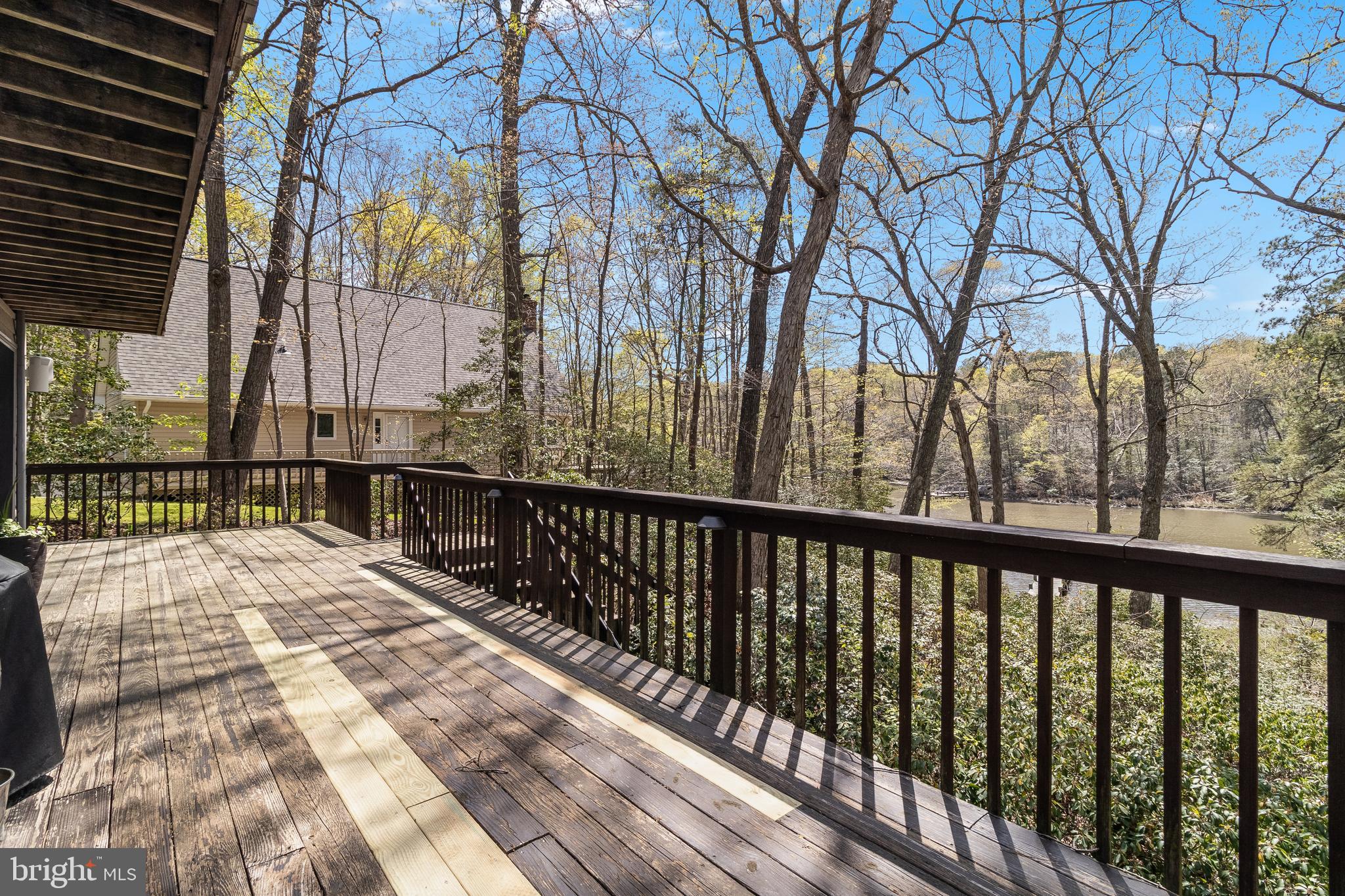 247 Frontier Trail Lusby, MD 20657 - Photo 52 of 62 a view of balcony with wooden floor and fence