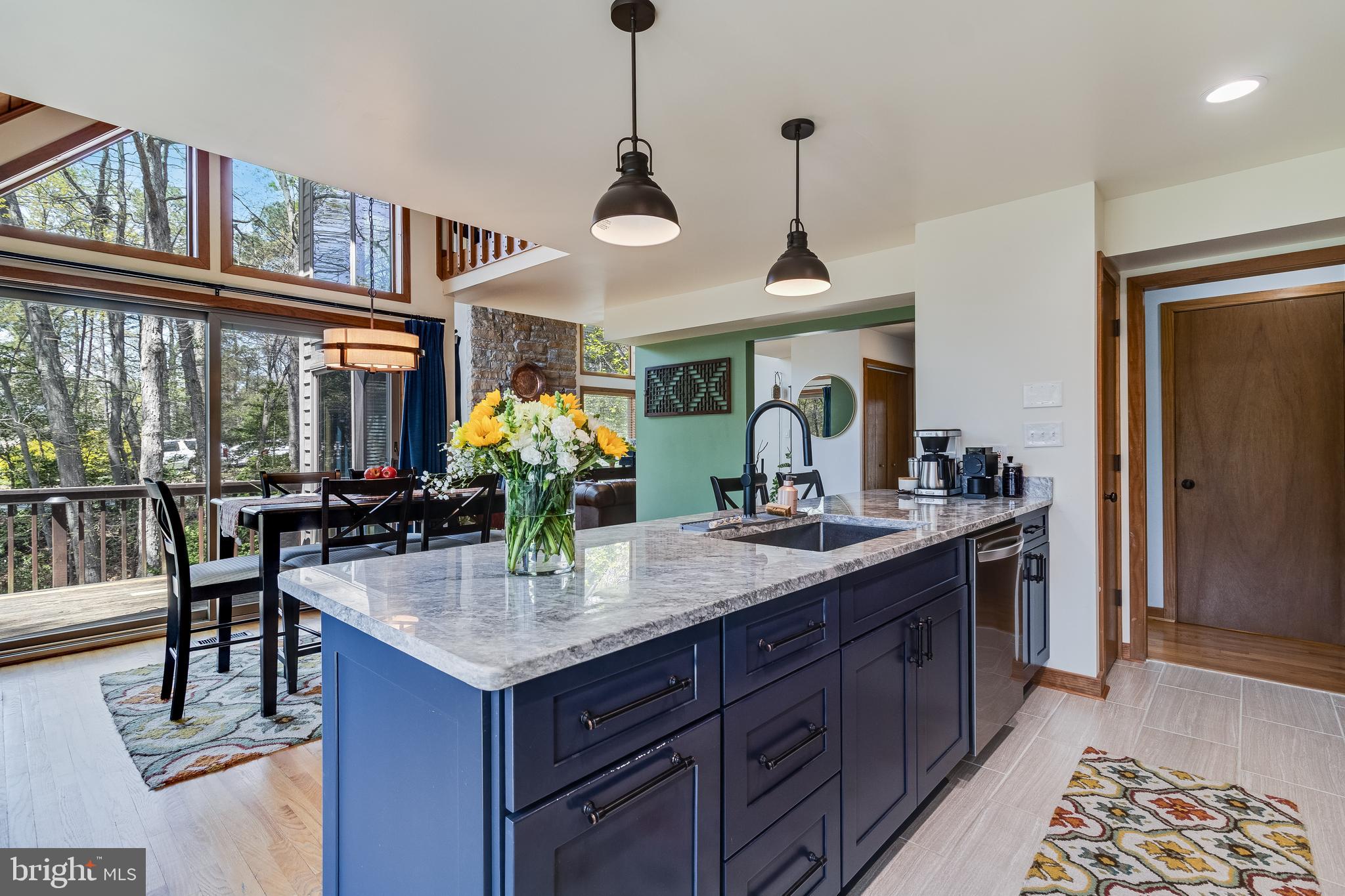 247 Frontier Trail Lusby, MD 20657 - Photo 8 of 62 a kitchen with stainless steel appliances granite countertop a sink and a refrigerator