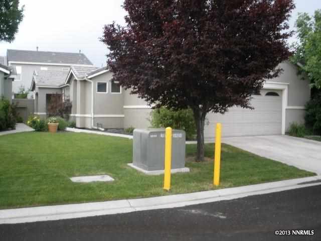 10416 Rockport Lane Reno, NV 89521 - Photo 1 of 1 a view of a white house with a sink and yard