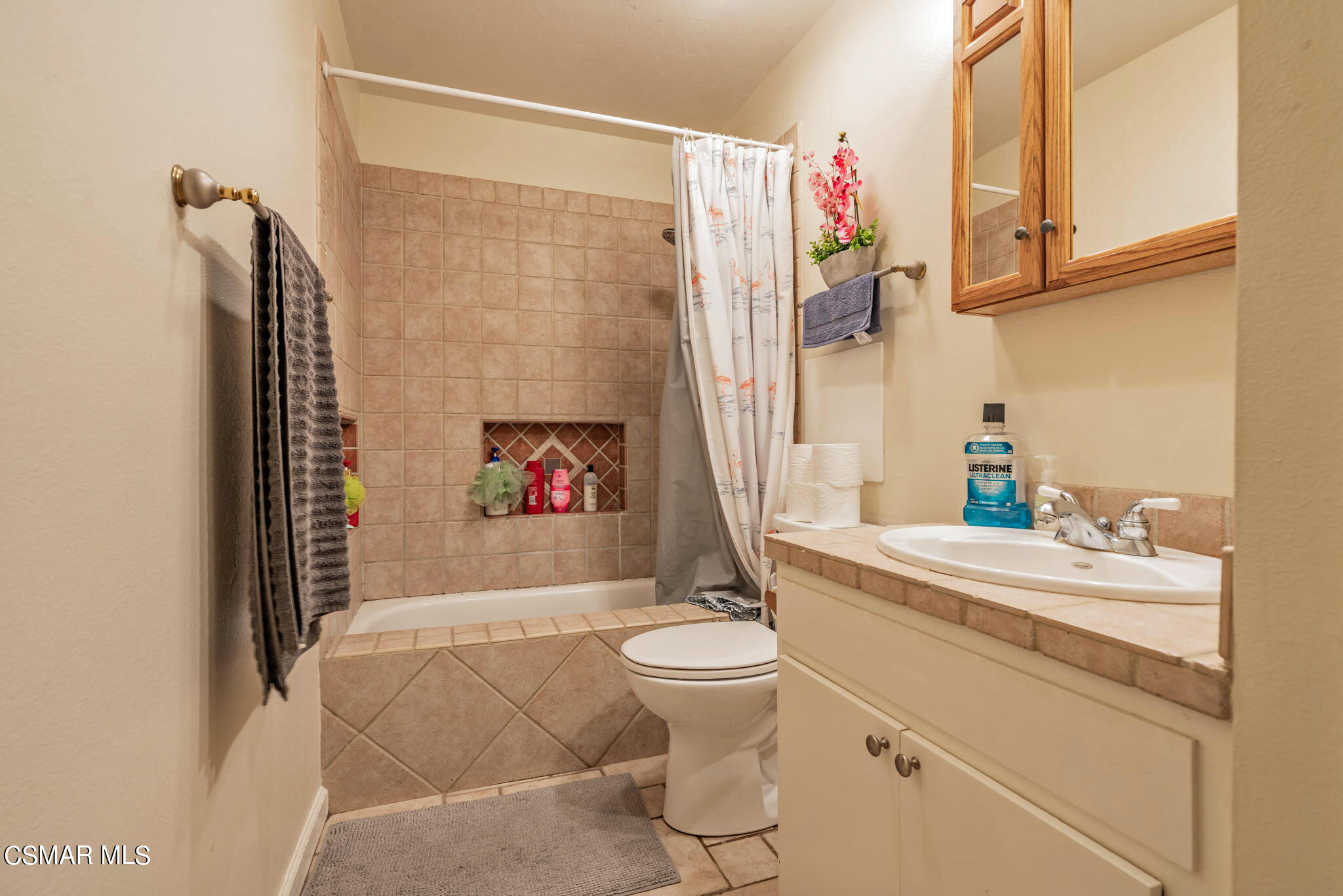 1765 Barnes Street Simi Valley, CA 93063 - Photo 12 of 30 a bathroom with a sink a toilet and shower curtain