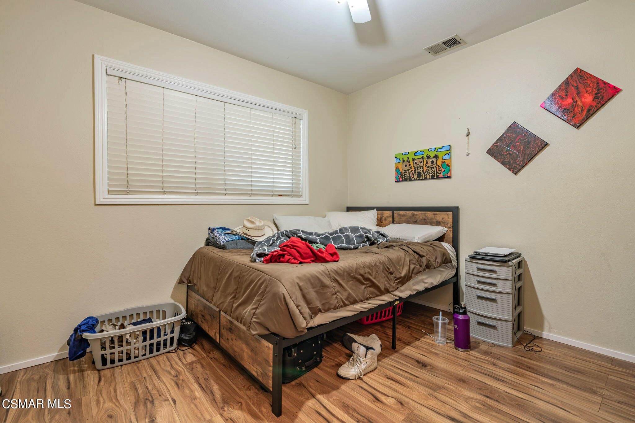 1765 Barnes Street Simi Valley, CA 93063 - Photo 14 of 30 a bedroom with a bed and wooden floor