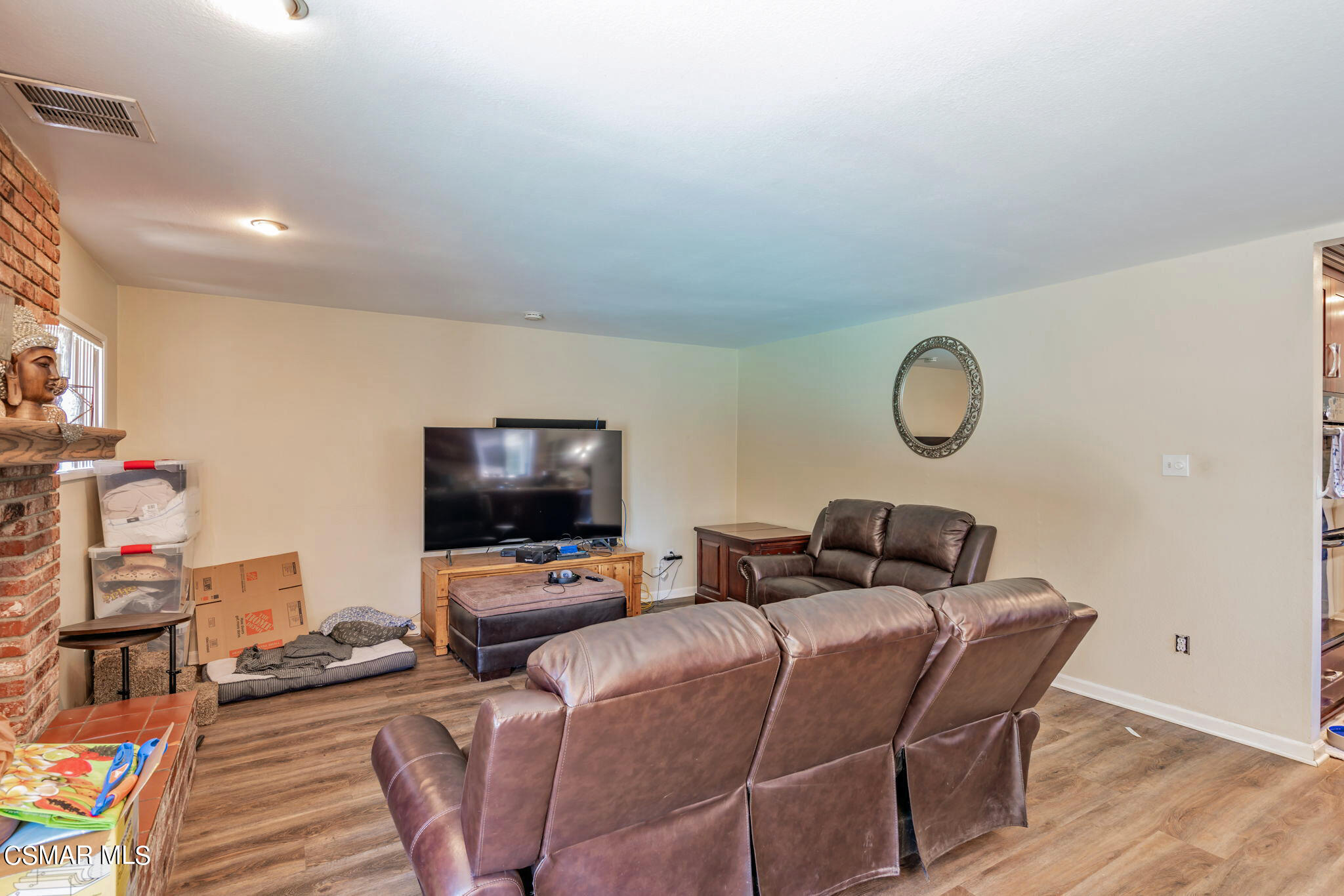 1765 Barnes Street Simi Valley, CA 93063 - Photo 19 of 30 a living room with furniture and a flat screen tv