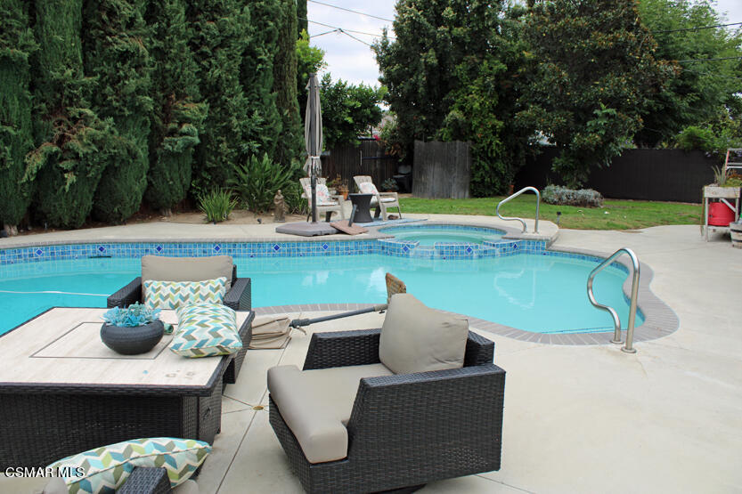 1765 Barnes Street Simi Valley, CA 93063 - Photo 22 of 30 a view of a swimming pool with a patio