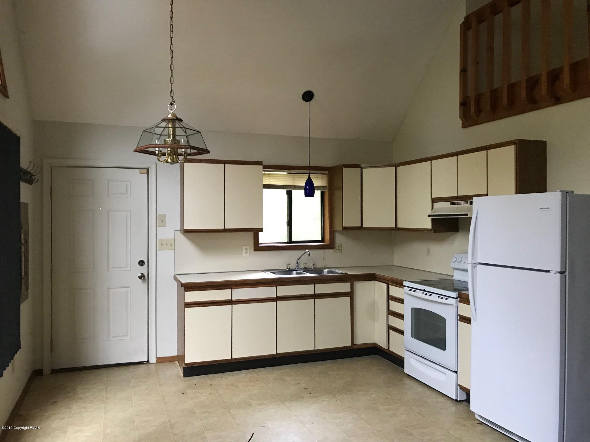 1129 Norfolk Road Tobyhanna, PA 18466 - Photo 1 of 14 a kitchen with stainless steel appliances granite countertop a sink a stove a refrigerator and island with wooden floor