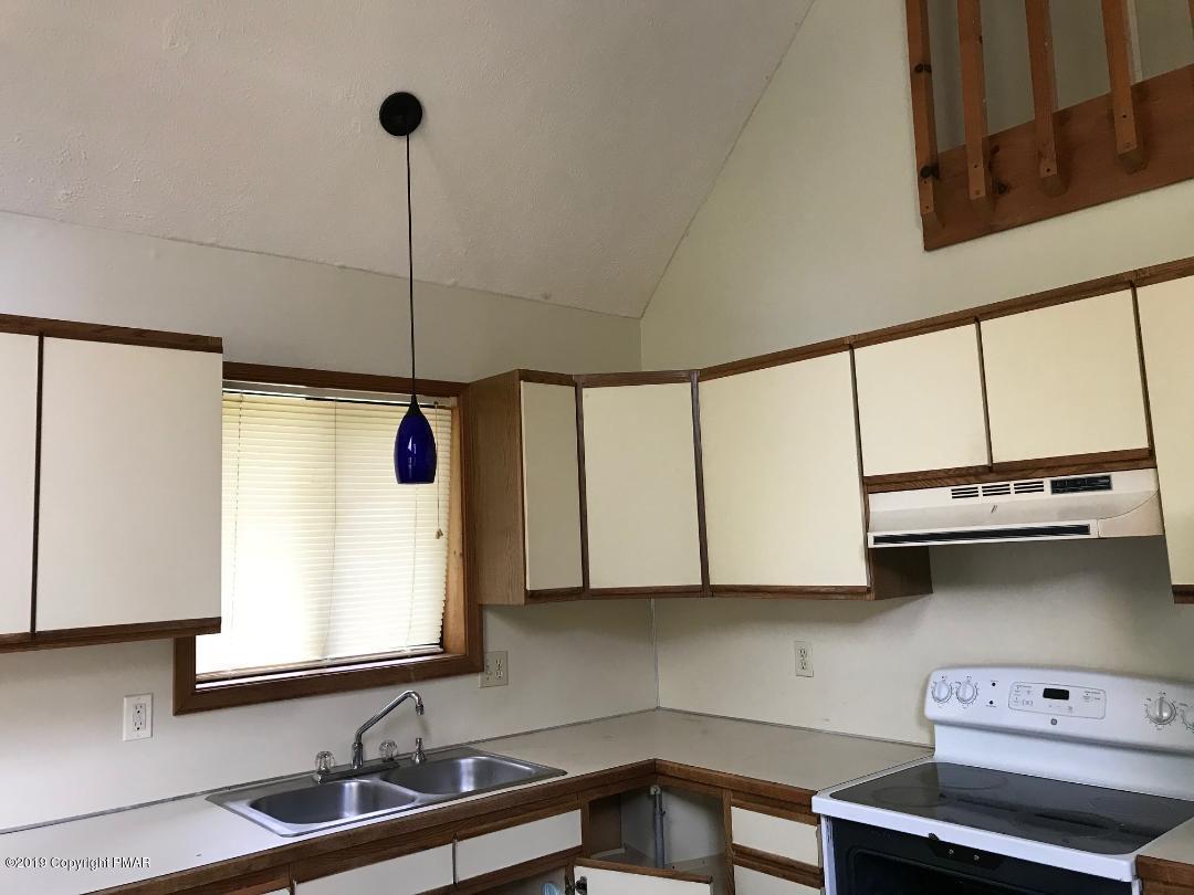 1129 Norfolk Road Tobyhanna, PA 18466 - Photo 14 of 14 a kitchen with stainless steel appliances a sink a stove and cabinets