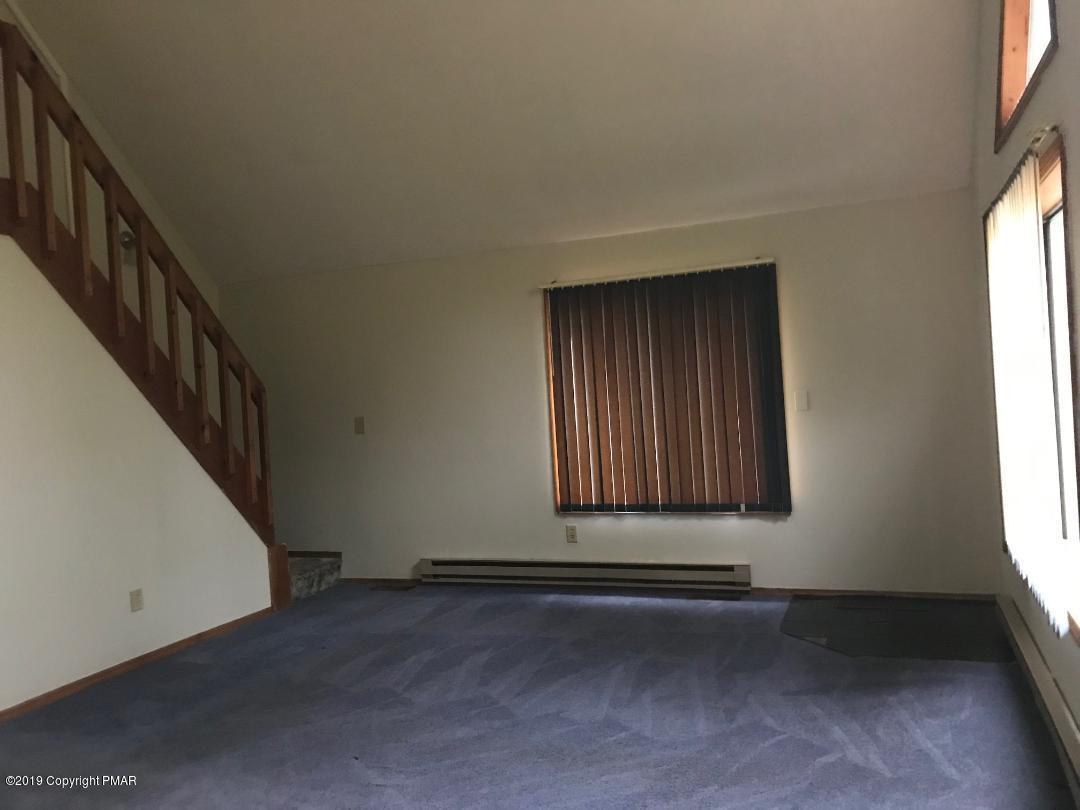 1129 Norfolk Road Tobyhanna, PA 18466 - Photo 4 of 14 a view of an empty room with a window