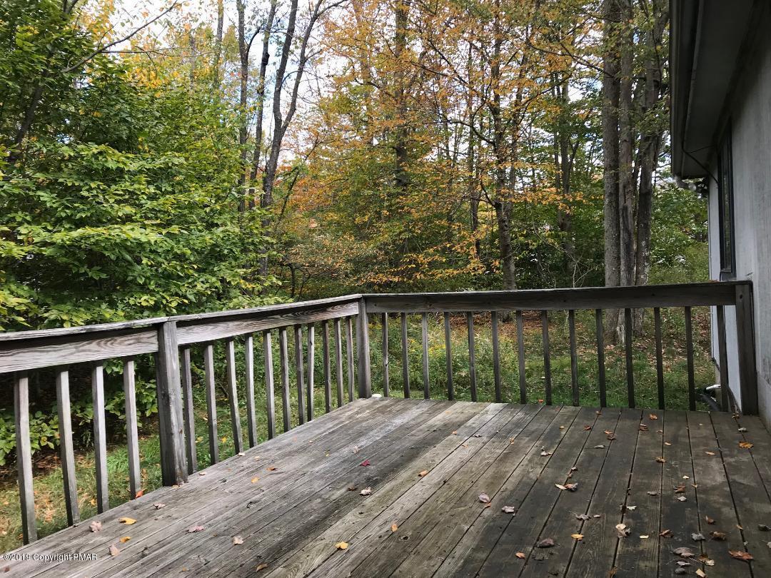 1129 Norfolk Road Tobyhanna, PA 18466 - Photo 10 of 14 a balcony with trees in front of it