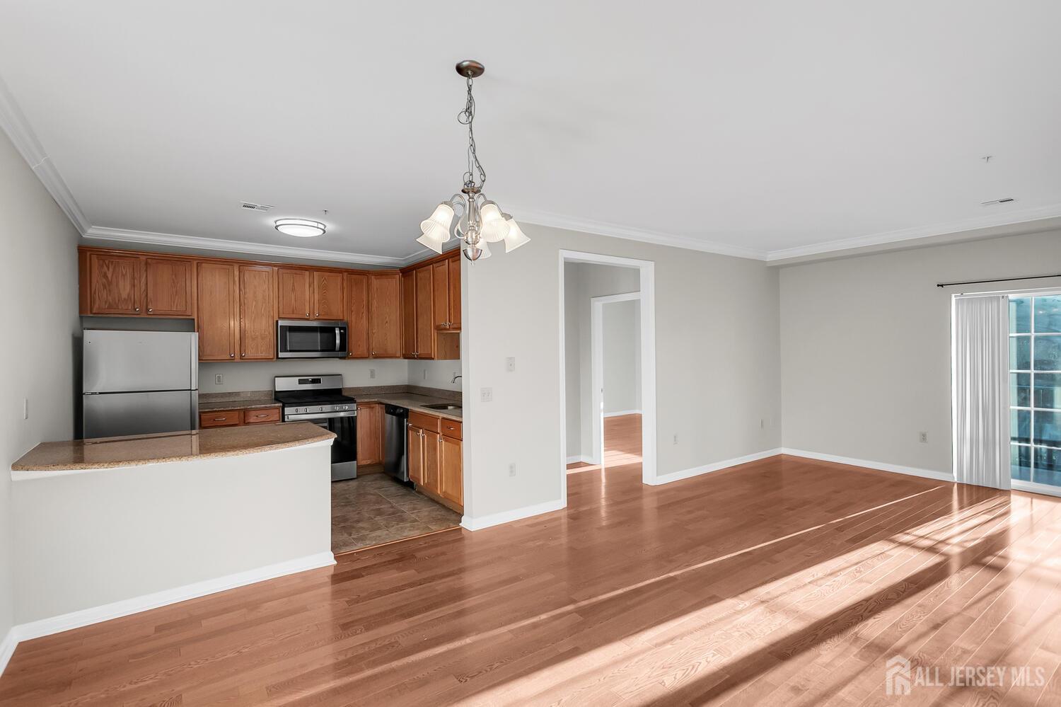 325 Regency Place Woodbridge, NJ 07095 - Photo 11 of 30 a view of kitchen with sink microwave and stove