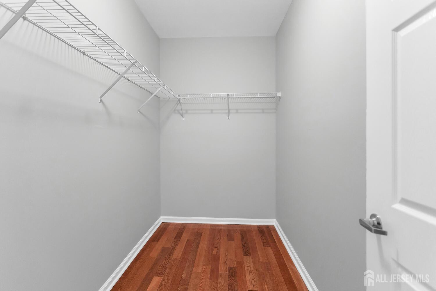 325 Regency Place Woodbridge, NJ 07095 - Photo 22 of 30 a view of a room with racks on the wall