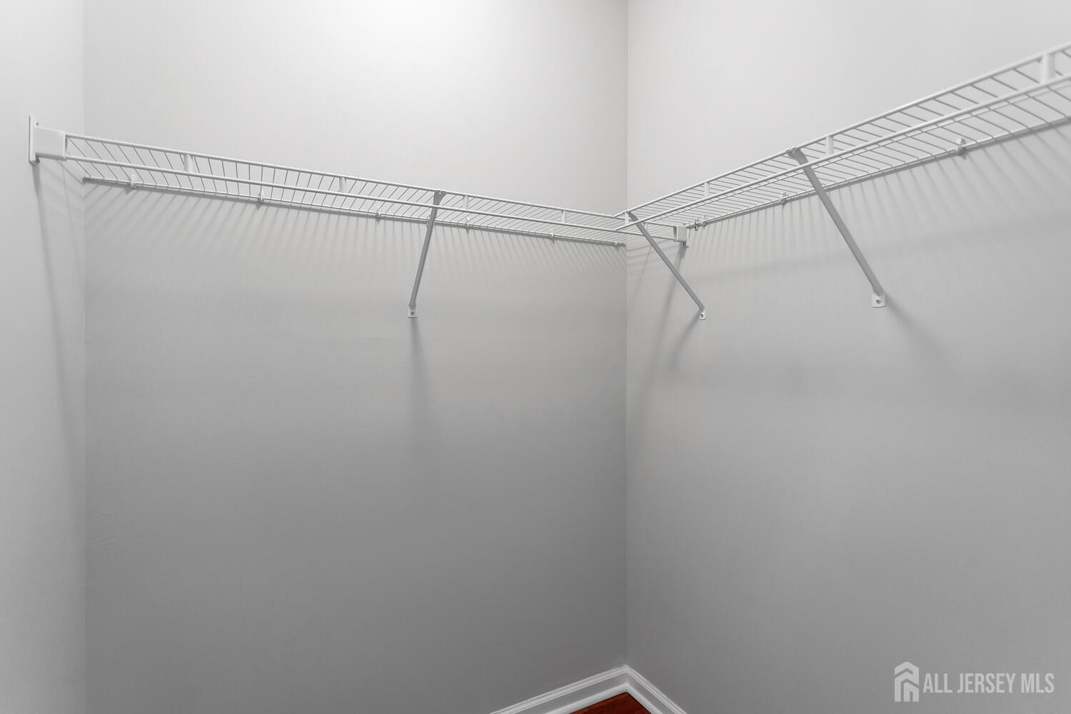 325 Regency Place Woodbridge, NJ 07095 - Photo 23 of 30 a view of a room with racks on the wall