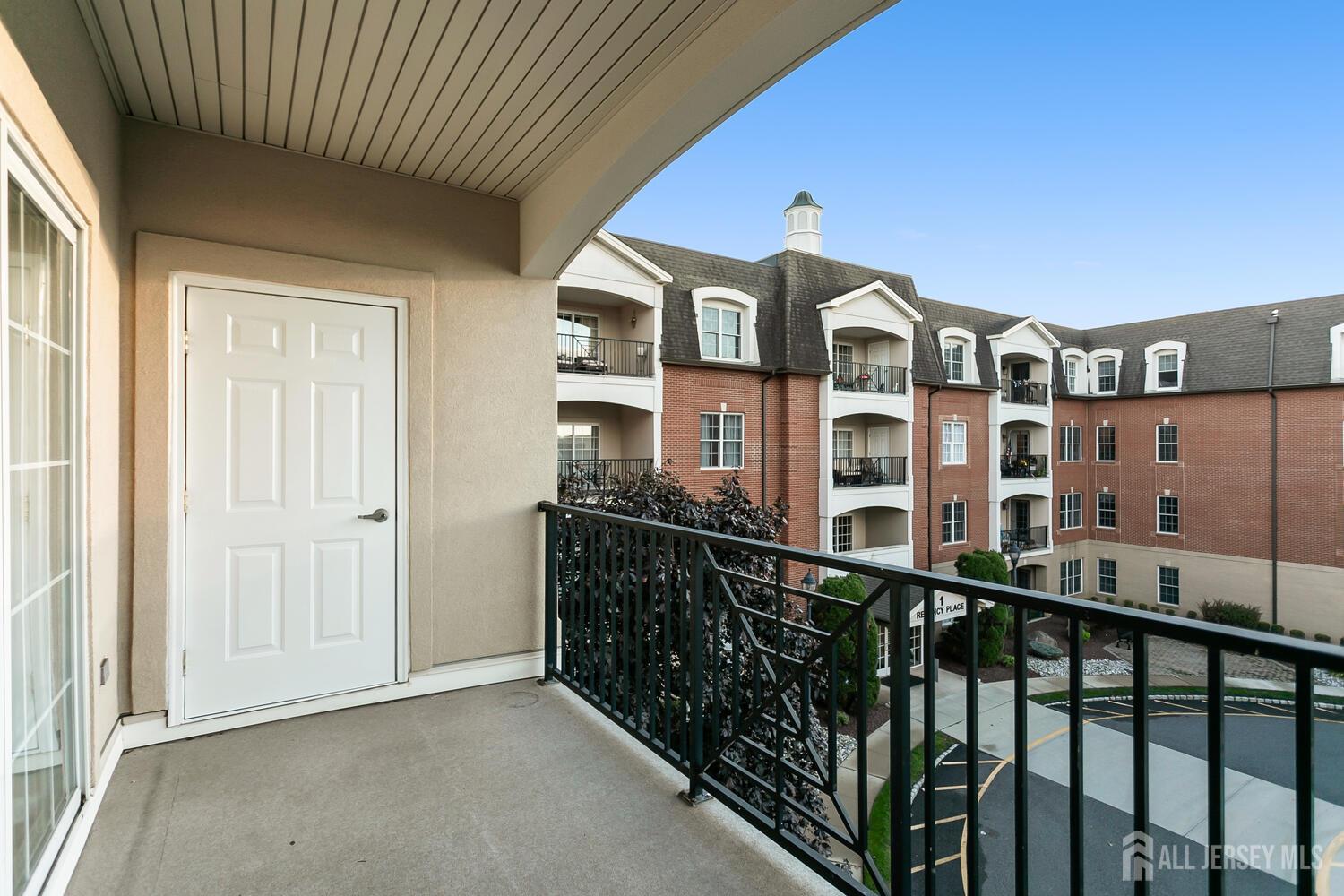 325 Regency Place Woodbridge, NJ 07095 - Photo 25 of 30 a front view of a building with glass windows