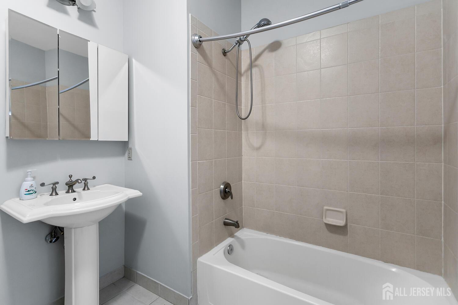 325 Regency Place Woodbridge, NJ 07095 - Photo 28 of 30 a white bath tub sitting next to a white sink