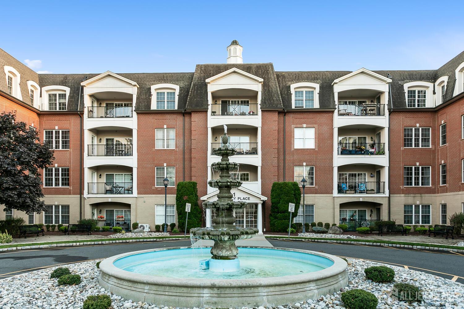 325 Regency Place Woodbridge, NJ 07095 - Photo 3 of 30 a front view of a multi story building