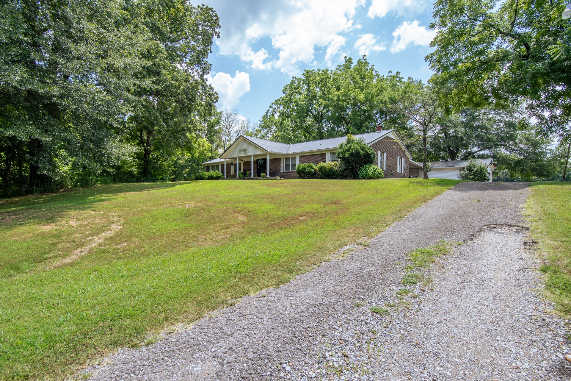 320 Rabbit Ranch Road Henderson, TN 38340 - Photo 48 of 66 a front view of a house with a yard and trees