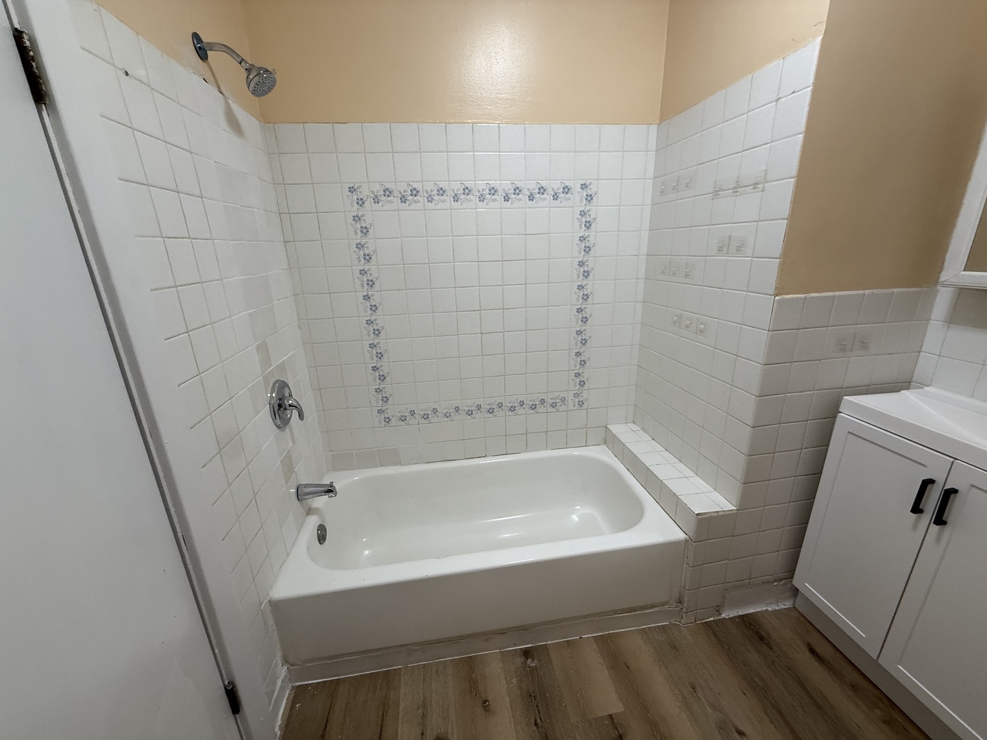 6441 West 23rd Street, Unit 14 Berwyn, IL 60402 - Photo 11 of 11 a white bath tub sitting next to a white sink and vanity