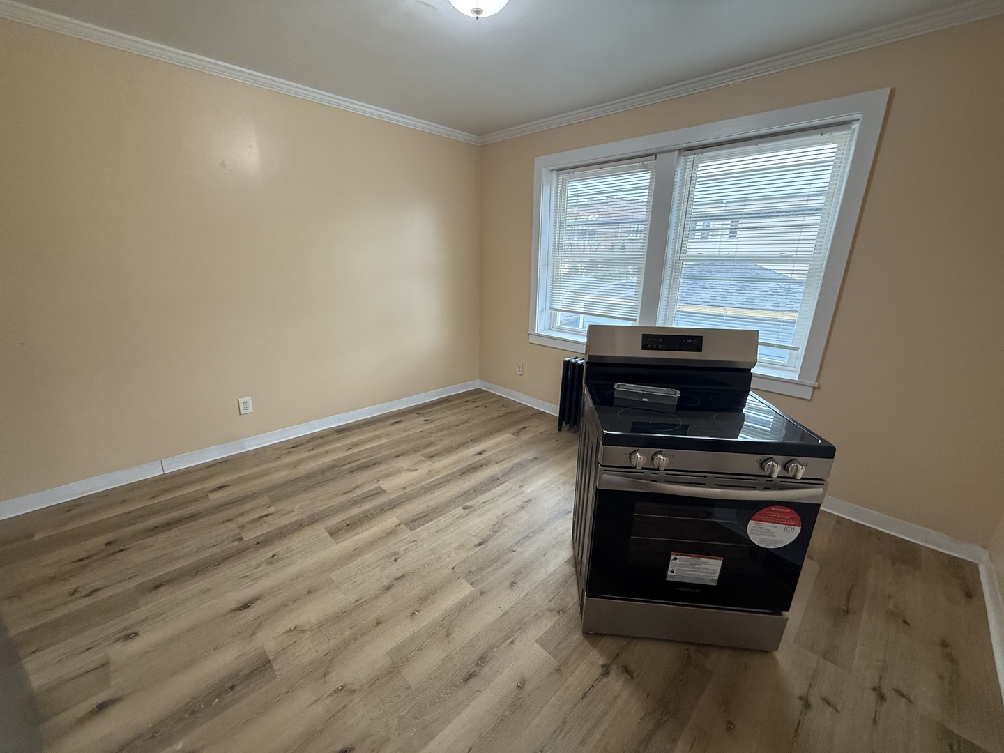 6441 West 23rd Street, Unit 14 Berwyn, IL 60402 - Photo 7 of 11 a view of wooden floor and a stove in a room