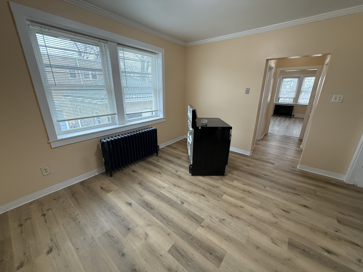 6441 West 23rd Street, Unit 14 Berwyn, IL 60402 - Photo 8 of 11 a view of empty room with wooden floor and fan