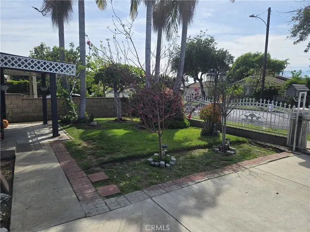 a view of a chair and table in backyard