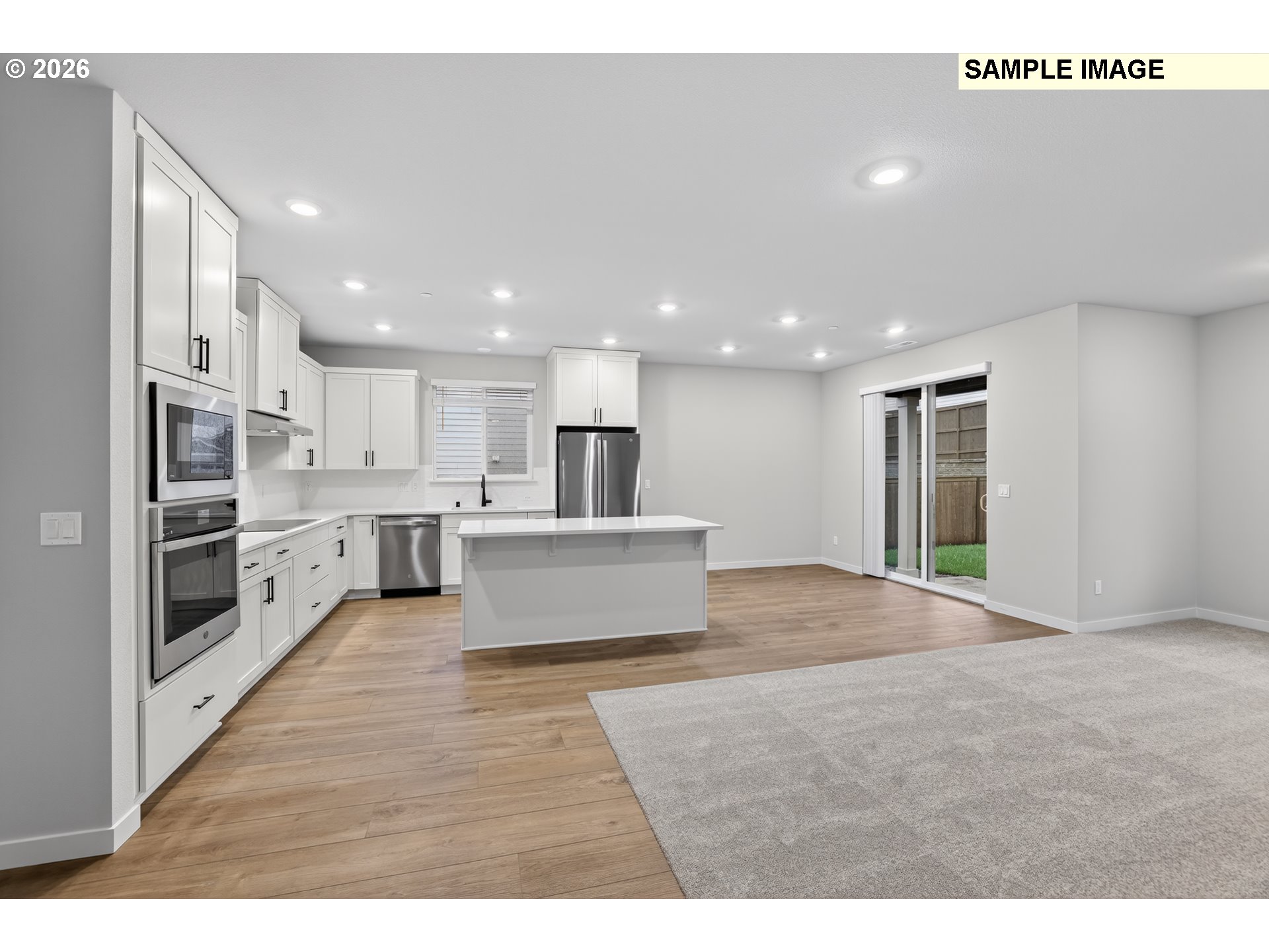 5272 North 87th Avenue Camas, WA 98607 - Photo 11 of 26 a view of kitchen with kitchen island sink and refrigerator