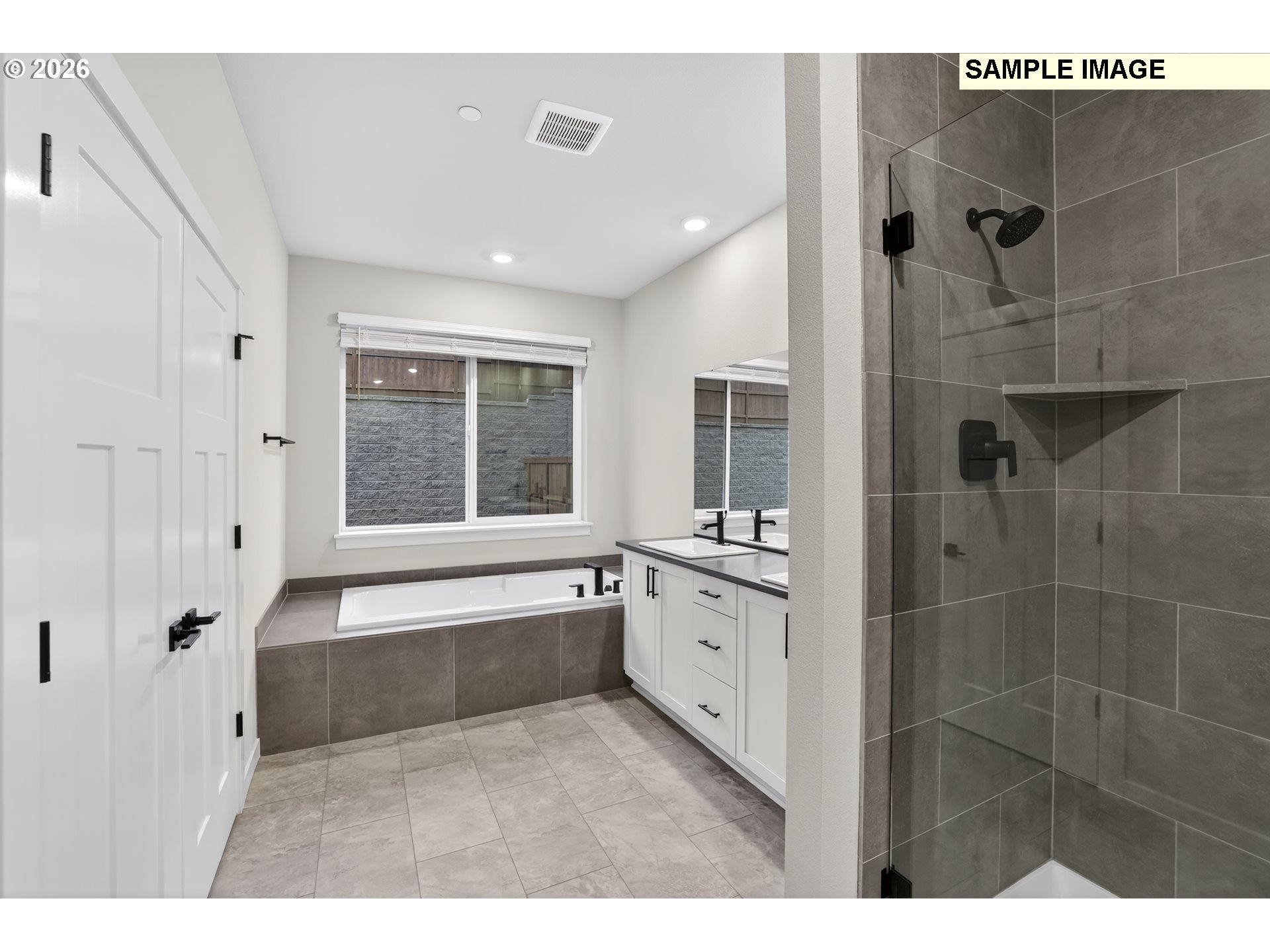 5272 North 87th Avenue Camas, WA 98607 - Photo 21 of 26 a bathroom with a granite countertop sink a large mirror and shower