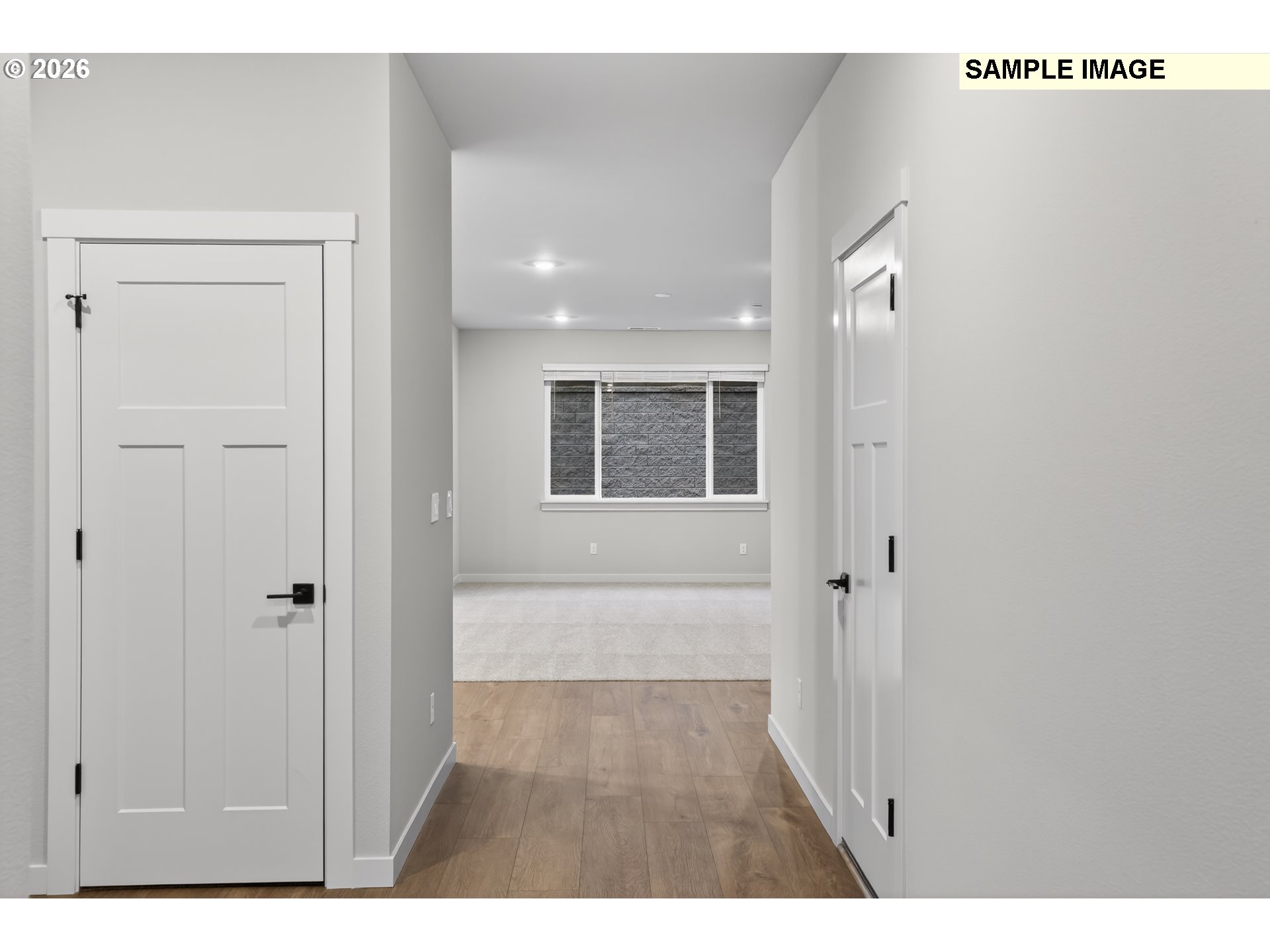 5272 North 87th Avenue Camas, WA 98607 - Photo 24 of 26 a view of a hallway with wooden floor and a bathroom