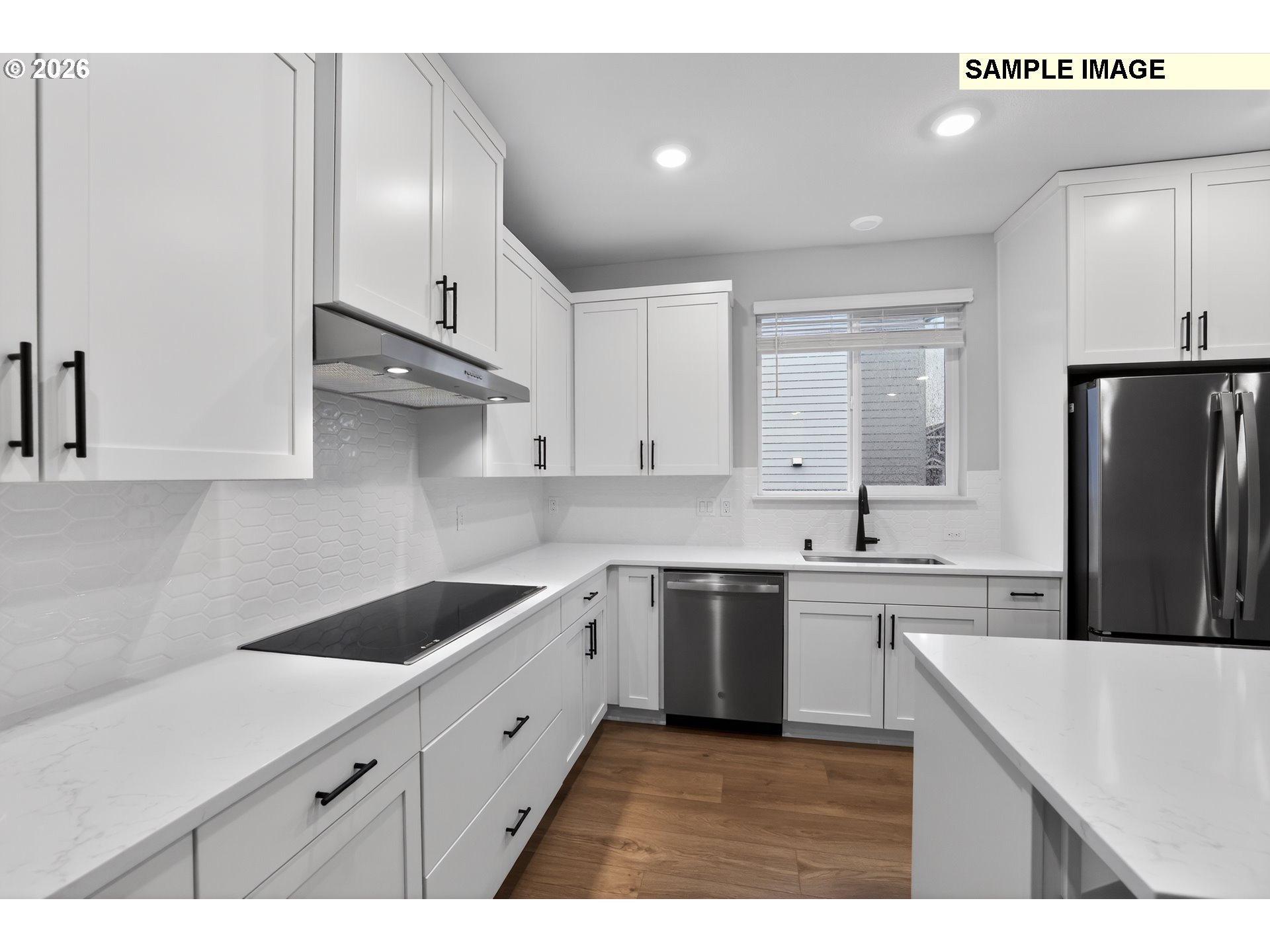5272 North 87th Avenue Camas, WA 98607 - Photo 6 of 26 a kitchen with stainless steel appliances granite countertop a sink a stove a refrigerator and island