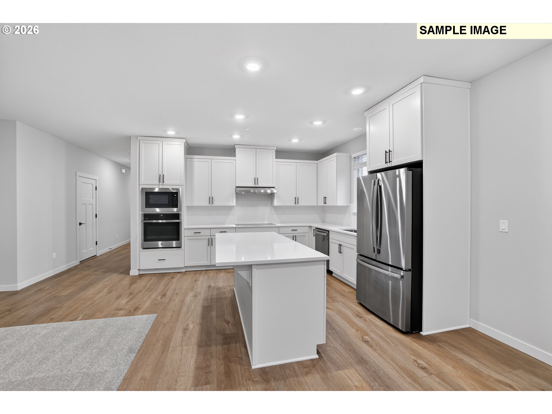 5272 North 87th Avenue Camas, WA 98607 - Photo 8 of 26 a open kitchen with refrigerator stove microwave and cabinets