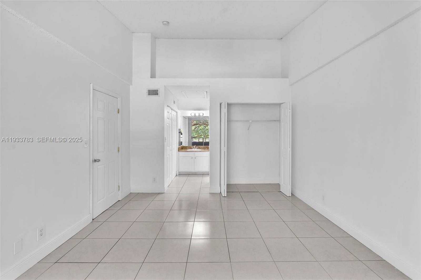 811 Lyons Road, Unit 20203 Coconut Creek, FL 33063 - Photo 16 of 23 a view of an empty room