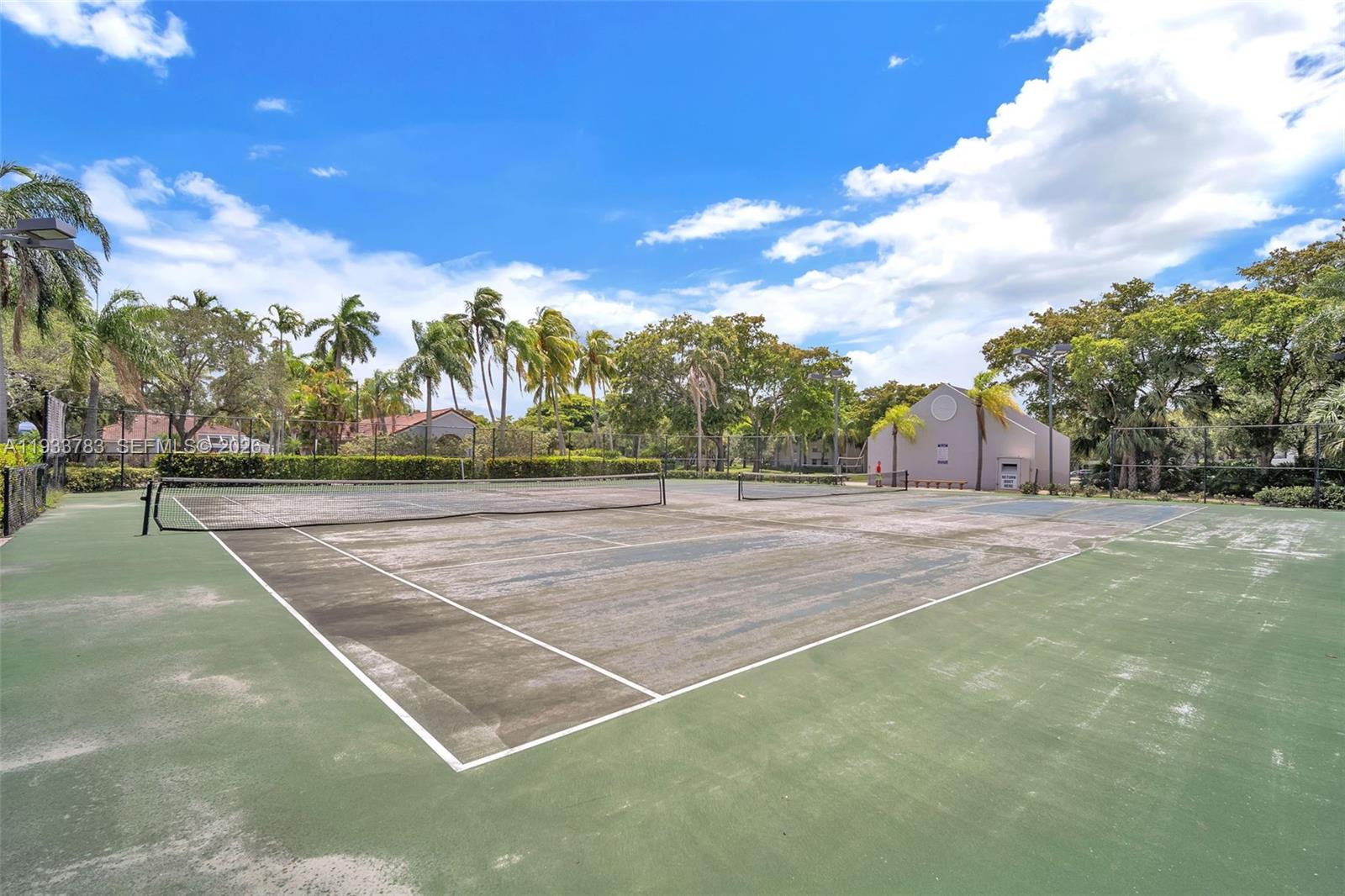 811 Lyons Road, Unit 20203 Coconut Creek, FL 33063 - Photo 21 of 21 a view of a tennis court