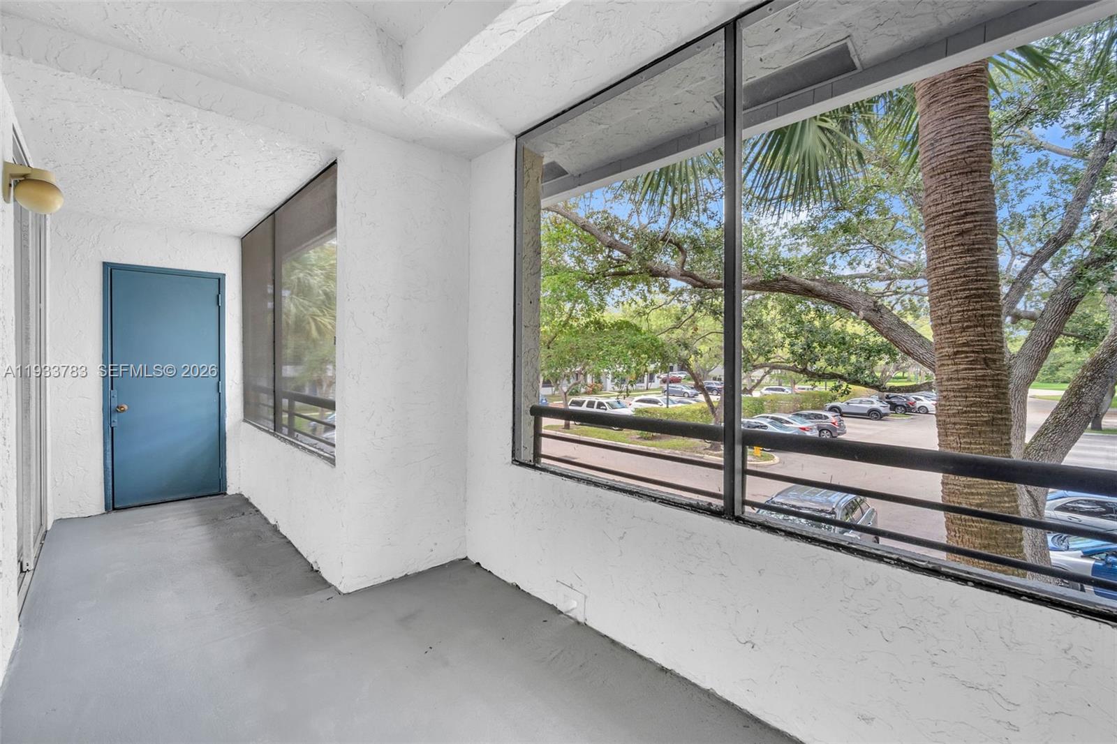 811 Lyons Road, Unit 20203 Coconut Creek, FL 33063 - Photo 3 of 21 a view of a room with large windows