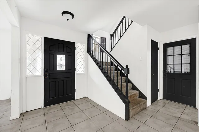 a view of entryway and hall with a window